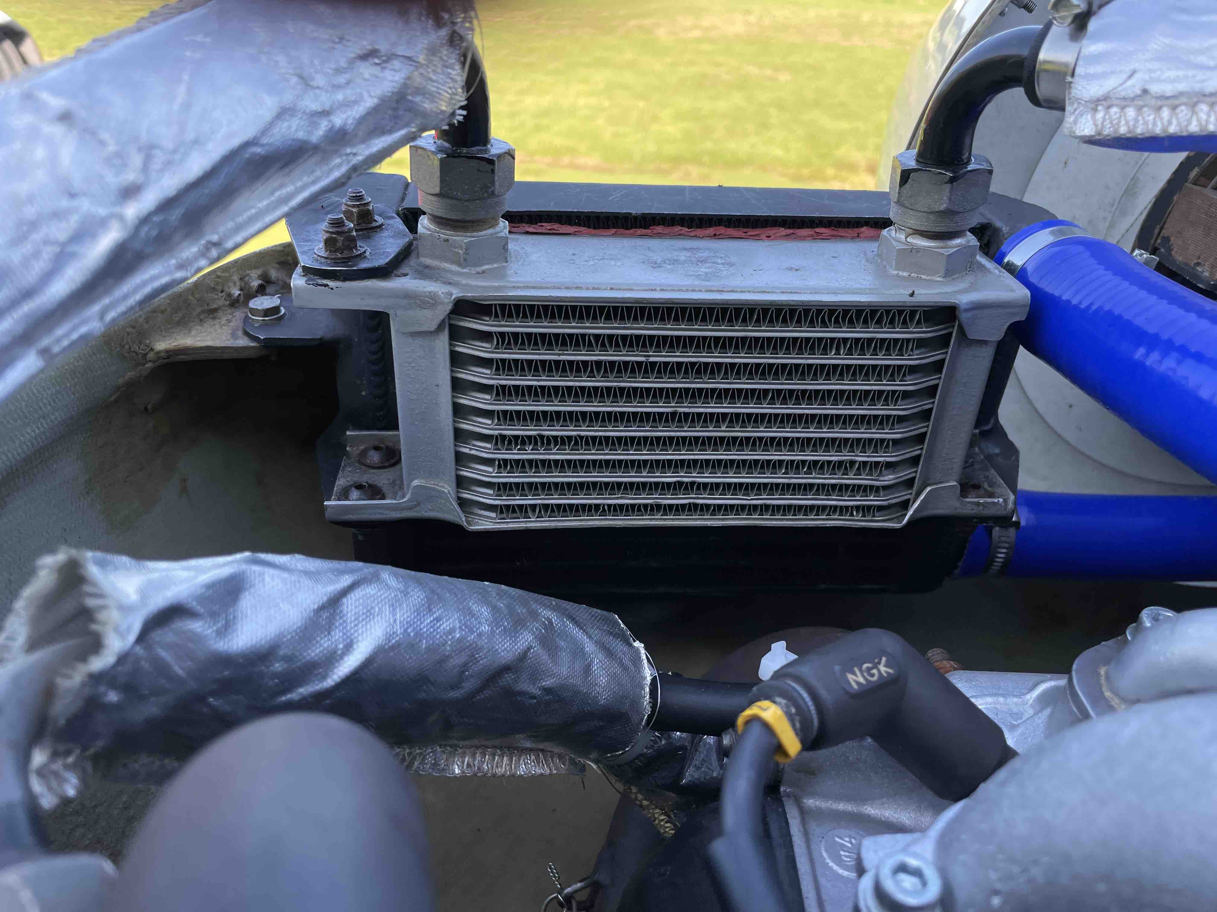 Original oil cooler mounted on radiator.jpg